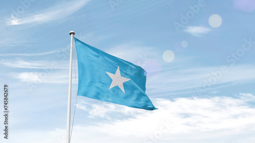 Somalia national flag cloth fabric waving on the sky.