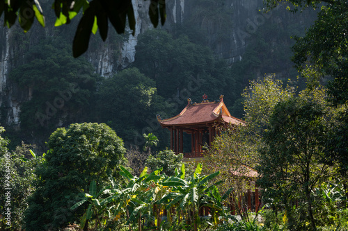 Temple roof of of Buddhist Đầm sen Bích Động with Mountain Background