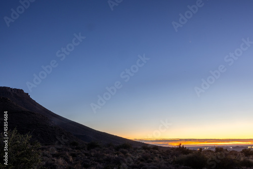 Blue hour Sunrise sky over the Karoo National Park with Beaufort West in the background, Karoo, Western Cape, South Africa