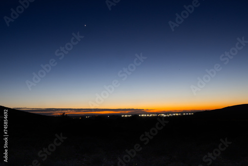 Blue hour Sunrise sky over the Karoo National Park with Beaufort West in the background, Karoo, Western Cape, South Africa