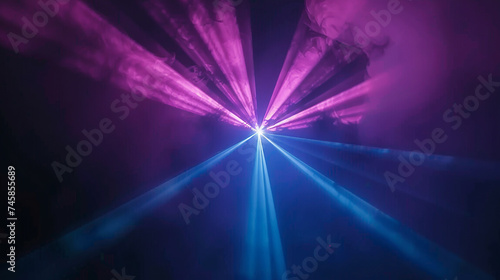 Violet, Purple and Blue beams of laser light shining on black background