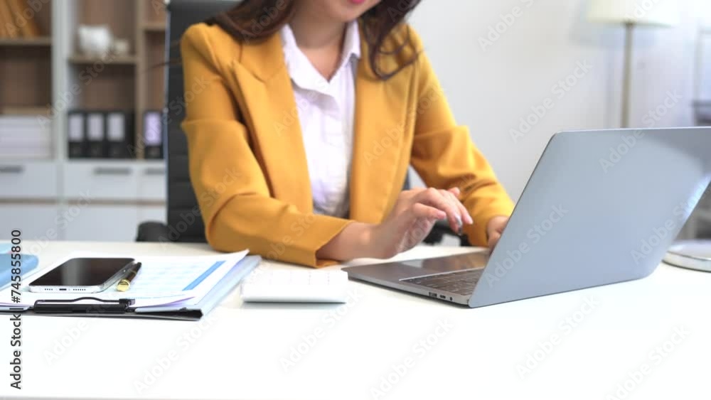 lifestyle of office workers Woman calculating expenses and using laptop. Home office. Work place. Lifestyle. lifestyle of office workers Woman calculating expenses and using laptop. Home office. Work place. Lifestyle.