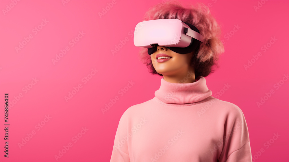 portrait of a young woman with virtual reality goggles. pink background. pink sweater. blonde hair. portrait of a young woman with virtual reality goggles. pink background. pink sweater. blonde hair.