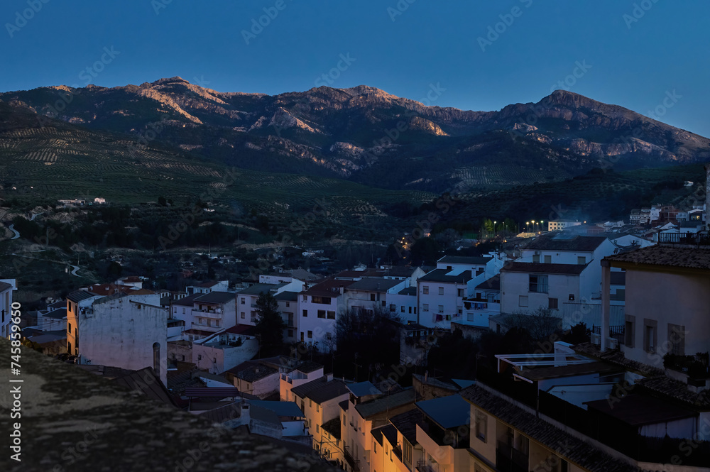 Sierra de Cazorla. Quesada, Jaen. Andalusia Spain. Beautiful mountains at evening and white buildings on the foreground.