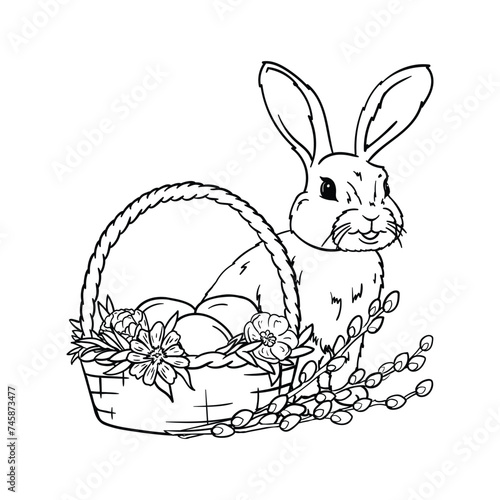 The Easter bunny sits near a basket with eggs, flowers, grass and pussy willow. Coloring book, black and white image