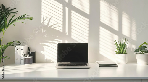 A minimalist home office with a white desk