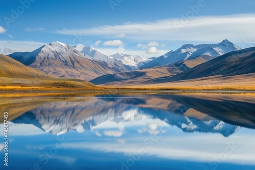 Serene lake reflecting the surrounding mountains calm and peaceful nature landscape © Nisit