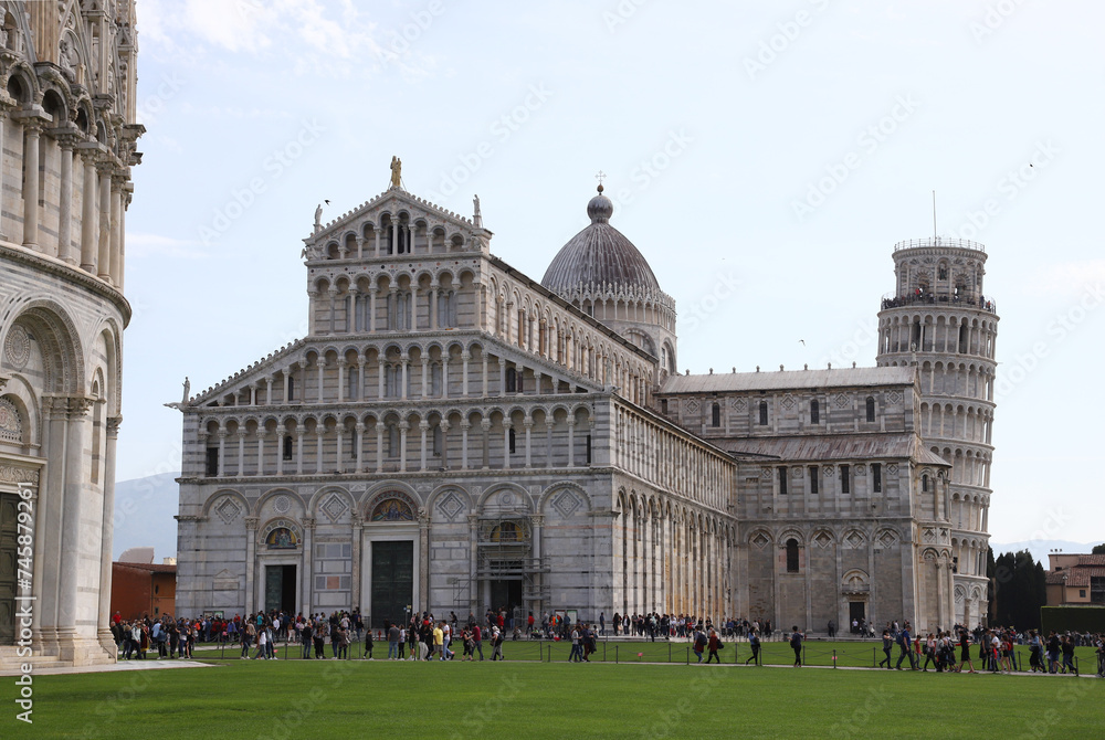 The Pisa Baptistery of St. John, The Cathedral and The Leaning Tower of Pisa in Square of Miracles, Tuscany , Italy.