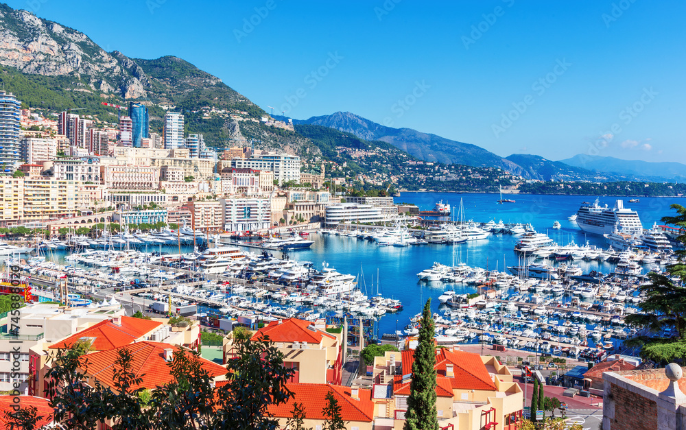 Monaco, Europe - October 13, 2018: Aerial panorama of the Monaco coastline and port with sailing boats and Riviera mountains in the background