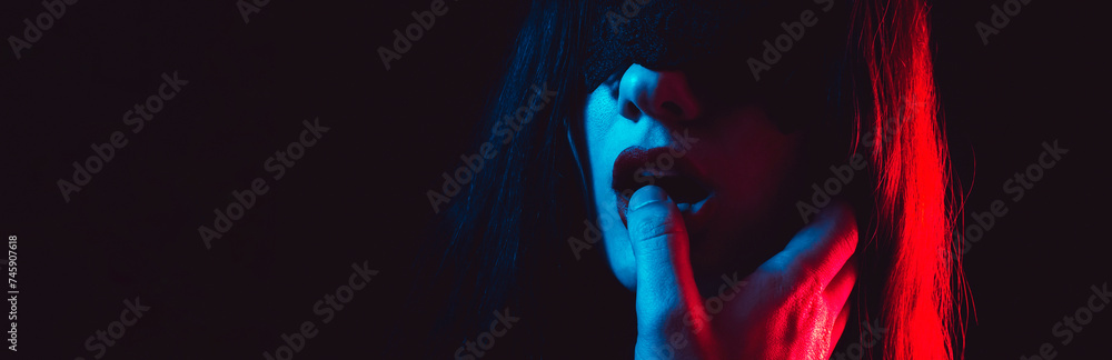 sexy submissive woman girl with a blindfold sucks the dominant man finger with her lips. BDSM sex with domination and submission. Wide banner - obrazy, fototapety, plakaty 