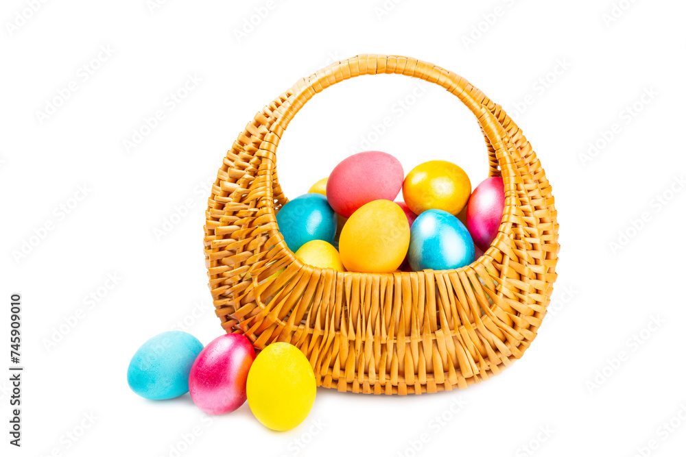Easter basket filled with colorful eggs isolated on white background. Easter celebration concept. Colorful easter handmade decorated Easter eggs. Easter basket filled with colorful eggs isolated on white background. Easter celebration concept. Colorful easter handmade decorated Easter eggs.