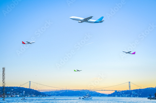 Passenger planes flying over the Bosphorus of Istanbul.