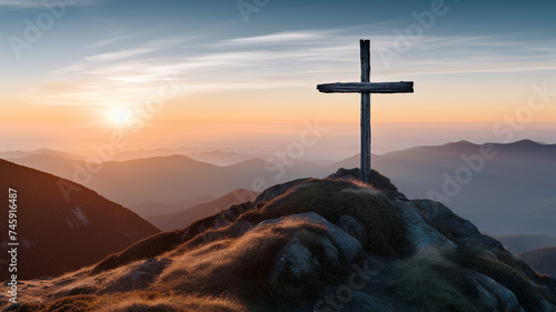 The cross stands on the top of the mountain.