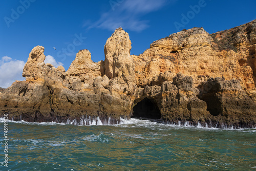 Algarve Coastline With Cave From The Atlantic Ocean In Lagos, Portugal