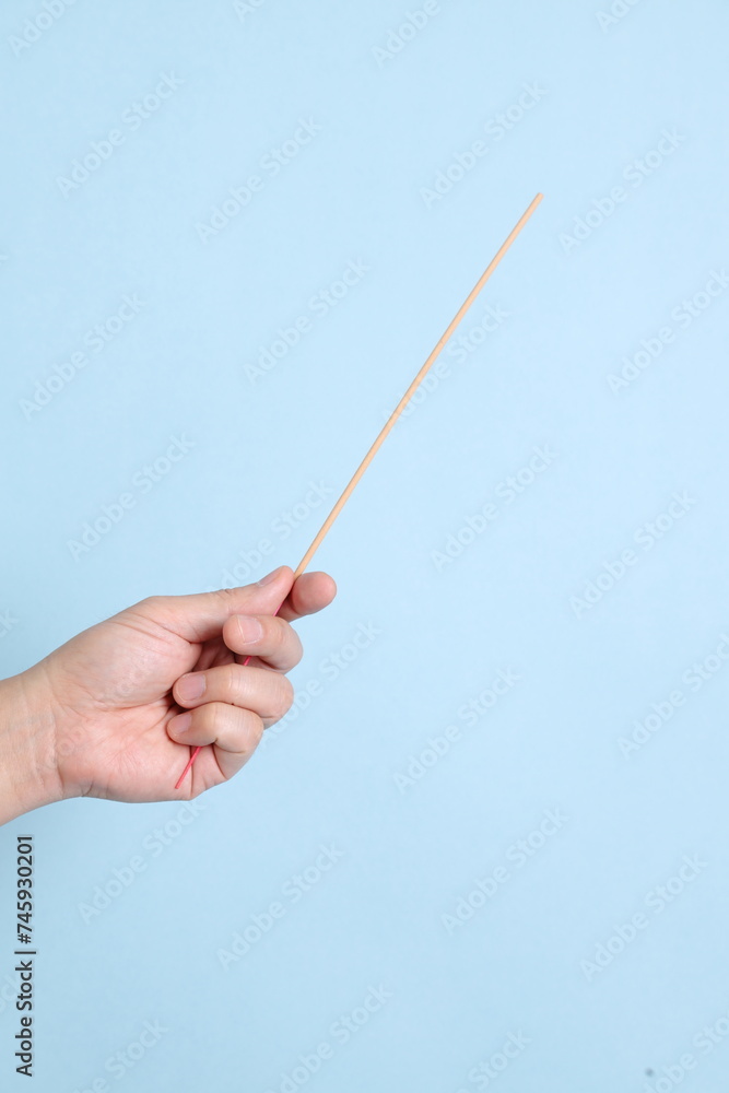 hand holding the incense sticks hand holding the incense sticks