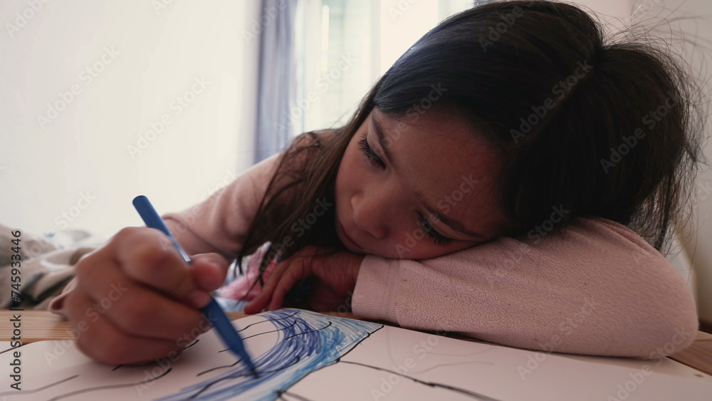 Small girl drawing on paper with coloring pen, childhood artistic leisure time. Child solo play Small girl drawing on paper with coloring pen, childhood artistic leisure time. Child solo play