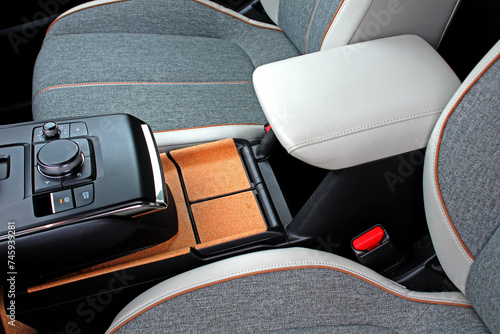 Wallpaper Mural Electric car armrest. Electric Car inside. Premium electric car interior with grey high-tech comfortable seats. Interior of prestige car. Comfortable perforated textile seats. Torontodigital.ca