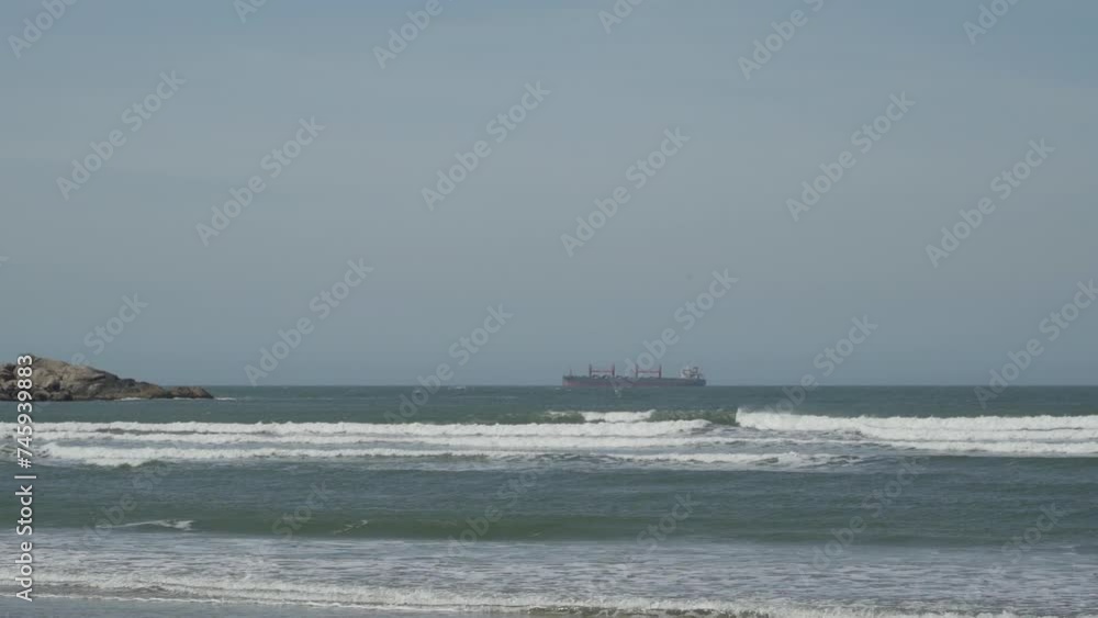cargo vessel at a white sand beach along the coastline of the atlantic ocean in Brazil. cargo vessel at a white sand beach along the coastline of the atlantic ocean in Brazil.