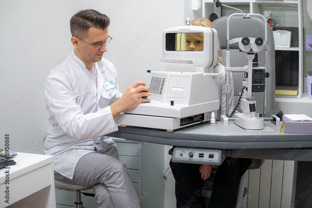 doctor and young patient in eye clinic, girl undergoing an eye test with professional optometrist using advanced diagnostic equipment, pediatric ophthalmology examination doctor and young patient in eye clinic, girl undergoing an eye test with professional optometrist using advanced diagnostic equipment, pediatric ophthalmology examination