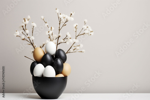 Easter composition with a black bowl full of black, white and brown eggs and white flowers. Copy space. Poster or banner for Easter advertising