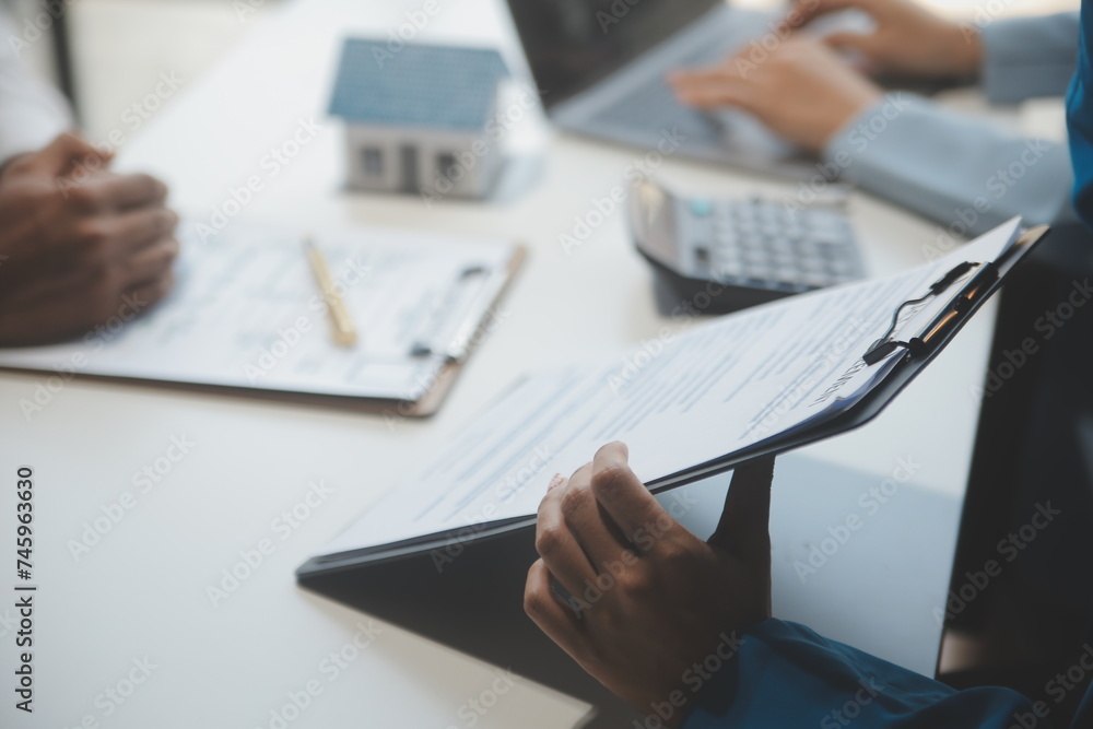 Real estate agent and customer signing contract to buy house, insurance or loan real estate.rent a house,get insurance or loan real estate or property. Real estate agent and customer signing contract to buy house, insurance or loan real estate.rent a house,get insurance or loan real estate or property.