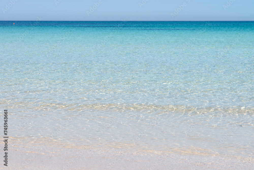 Fototapeta premium Transparent seawater at the sand beach in Udo Island