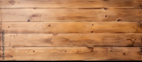 A detailed close-up view of a wooden plank wall, showcasing the grain and texture of the wood. The individual planks are visible, creating a rustic and natural aesthetic.
