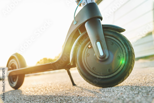 Wallpaper Mural Electric scooter in city, electric urban transportation concept. CO2 zero emissions transportation. Ecology environmentalism concept. Green way of living Torontodigital.ca