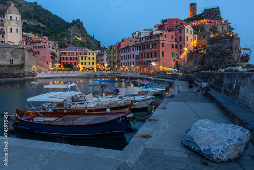 The illuminated historic center of Vernazza at sunset, Cinque Terre, Liguria, Italy