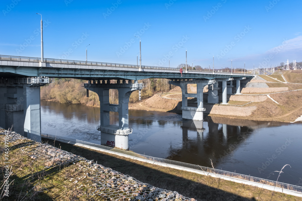 steel frame and concrete construction huge car bridge across the wide river