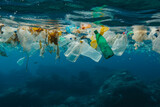Group of Plastic Bottles Floating in Ocean