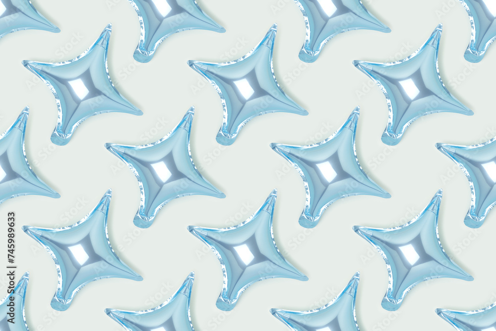 Pattern made of foil star balloons on a blue background. Festive creative concept. Pattern made of foil star balloons on a blue background. Festive creative concept.