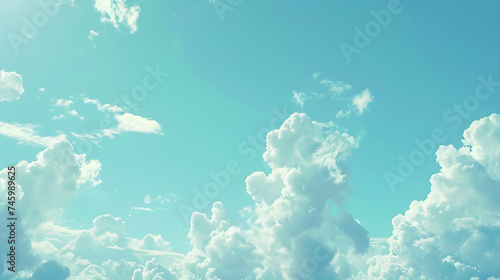 A vast clear sky with drifting clouds during the daytime.