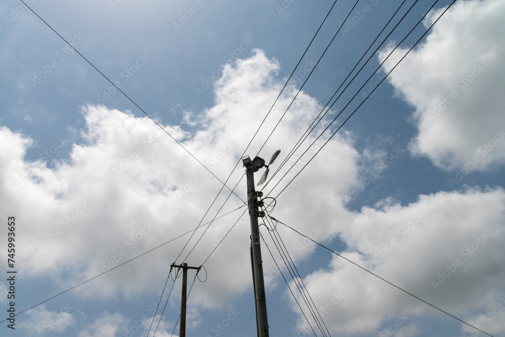 View of the electric pole with the cables View of the electric pole with the cables