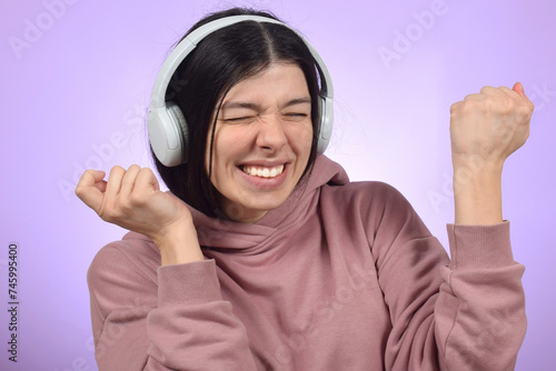 Young beautiful woman listening to music 