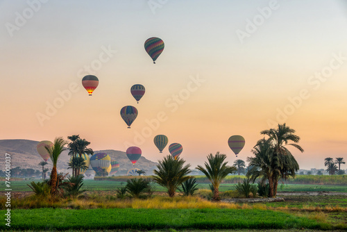 Take off of coloful hot air balloons at sunrise near the the Valley of Kings in Luxor West bank, Egypt