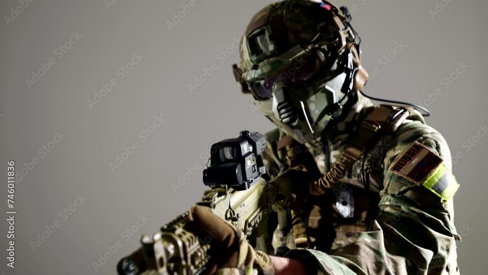 professional Russian soldier with modern rifle in hands, aiming in target, closeup view and portrait professional Russian soldier with modern rifle in hands, aiming in target, closeup view and portrait