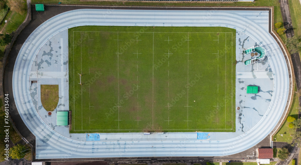 Aerial view of a sports complex with track and field