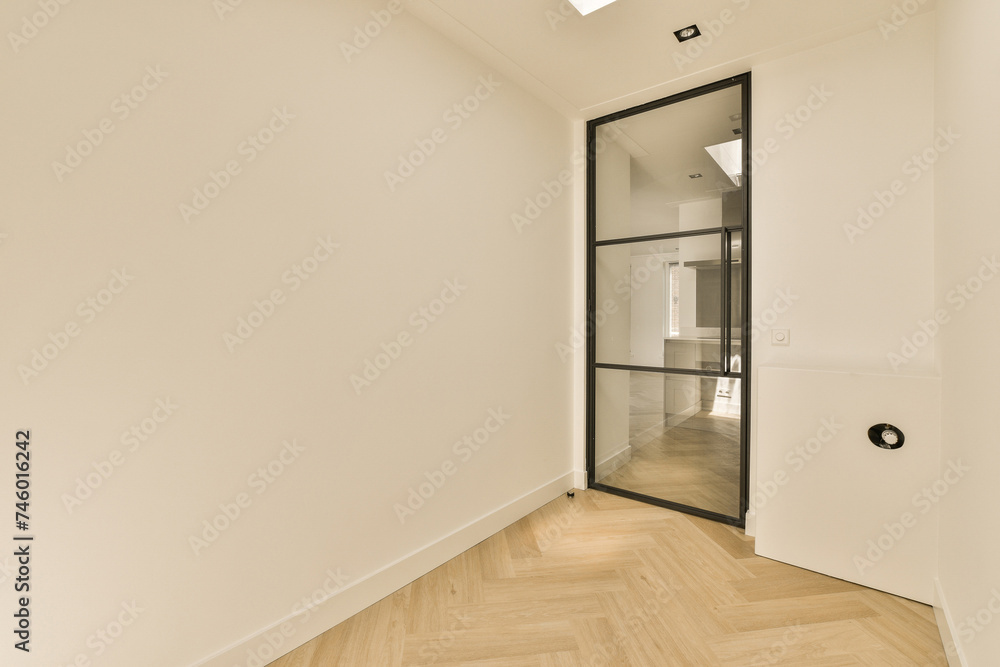 Modern Home Interior with Glass Door and Wooden Flooring Modern Home Interior with Glass Door and Wooden Flooring
