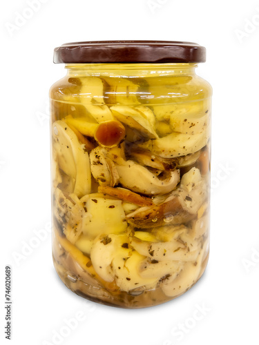Mushroom mix with boletus edulis in oil in glass jar isolated