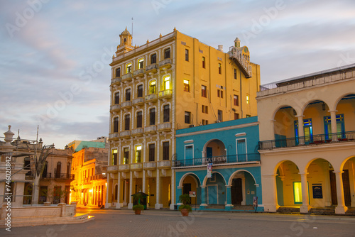 Historic buildings on Old Town Square (Plaza Vieja) in the morning in Old Havana (La Habana Vieja), Cuba. Old Havana is a World Heritage Site.  photo