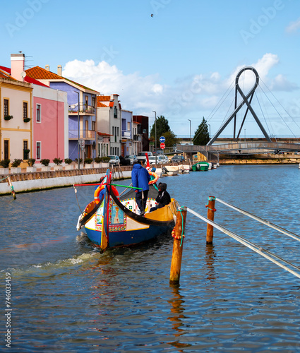 Barco moliceiro num canal da Ria de Aveiro na cidade de Aveiro photo