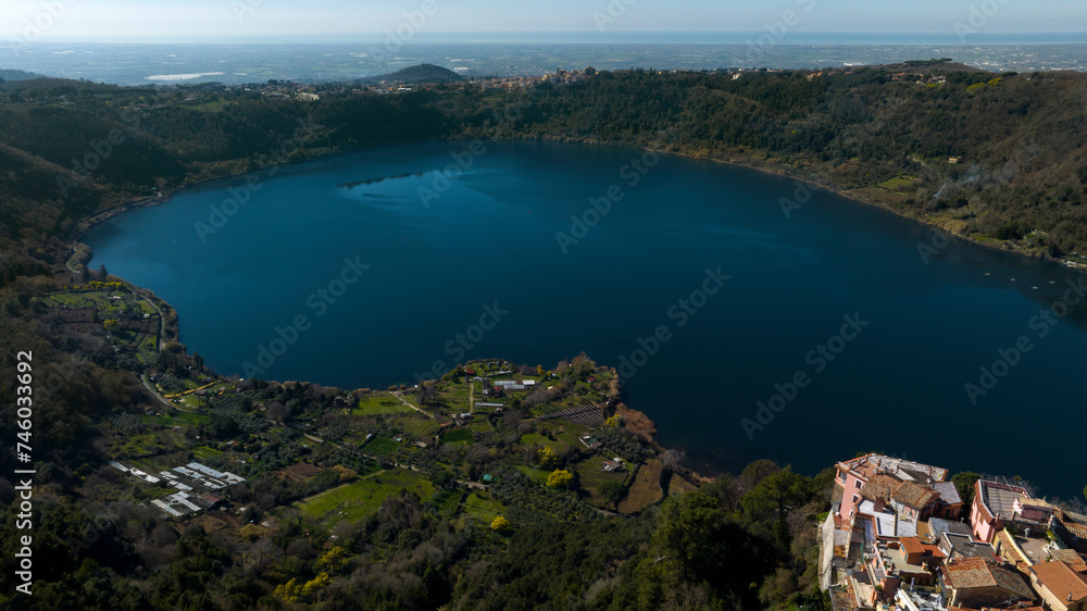 Aerial view of Lake Nemi. It is a small circular volcanic lake in the Alban Hills, near Rome in the Lazio region of Italy. It was formed in an ancient volcanic crater.