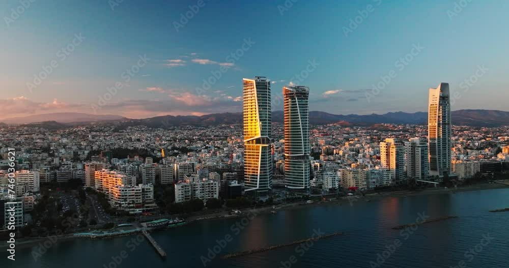 Majestic Sunset Over Limassol, Cyprus. Aerial Perspectives of Limassol's Modern Urban Landscape with High-Rise Glass Structures.