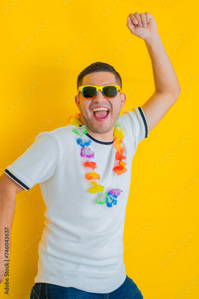 young Latino man celebrating and shouting that his team won and triumphed, while jumping up and down and raising his hands young Latino man celebrating and shouting that his team won and triumphed, while jumping up and down and raising his hands