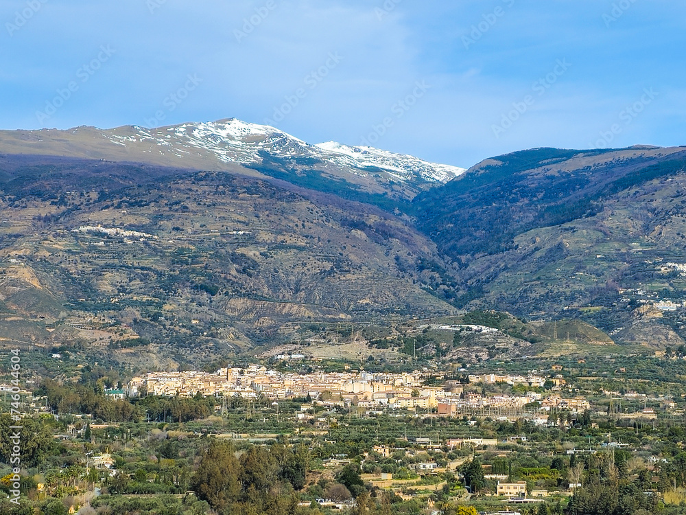 view of Orgiva with Sierra Nevada in the background in the Alpujarra of Granada