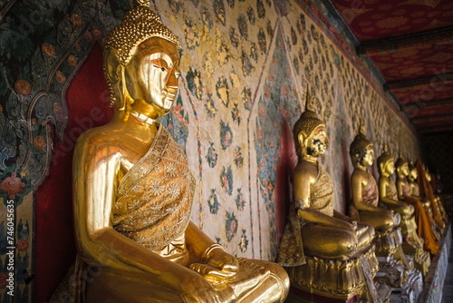Golden Buddhas in a temple in Thailand