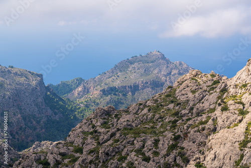 Amazing landscapes of Mallorca. Majestic mountains covered with clouds, Sunny day. Mallorca, Spain, Balearic Islands