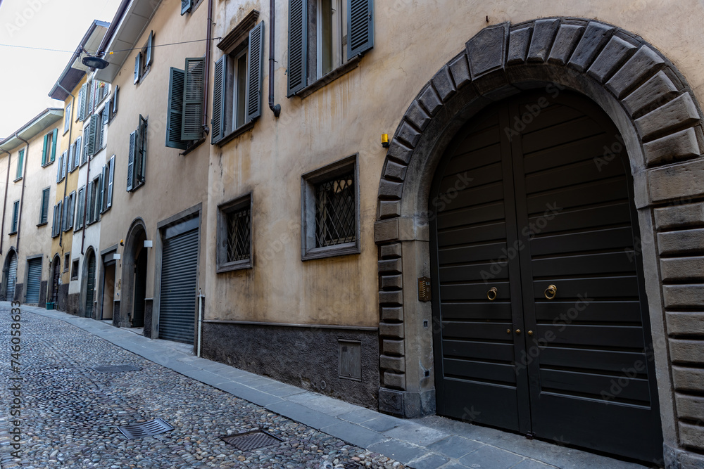 Fototapeta premium An old building with arched gates in the Italian city of Bergamo