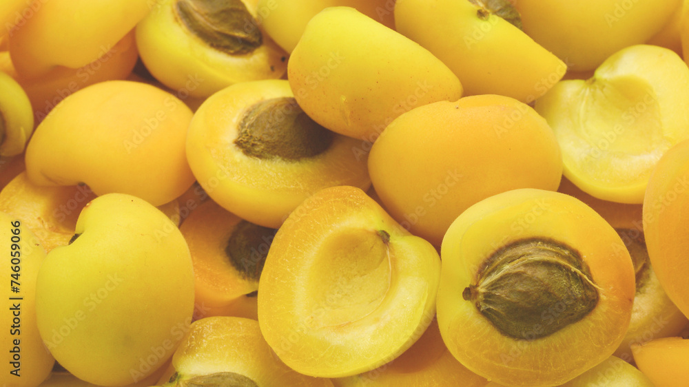 Ripe juicy orange apricots slices fruit background. Ripe juicy orange apricots slices fruit background.